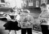 2ND AND FRANKLIN STREETS IN WILMINGTON DELAWARE - KELLEY SIBLINGS ADMIRING NEIGHBORS NEW LUNCH BOX IN 1958