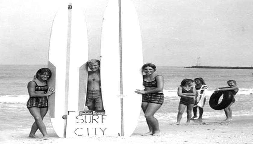 Surfers at the Indian River Inlet in Sussex County Delaware circa late 1950s